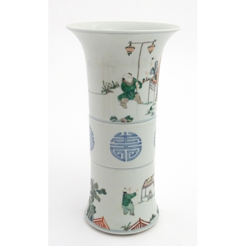 57 - A Chinese famille verte vase of Gu form decorated with figures, children playing and flying kites. A... 