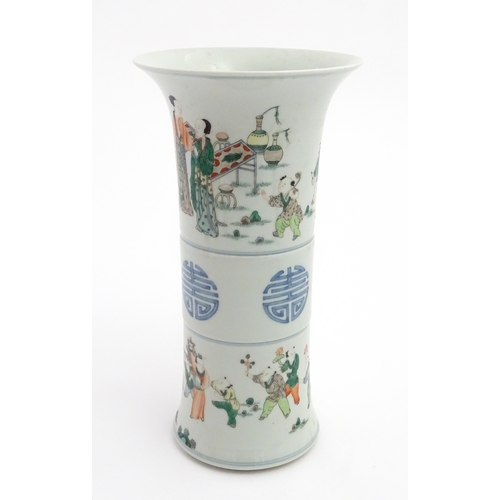 57 - A Chinese famille verte vase of Gu form decorated with figures, children playing and flying kites. A... 