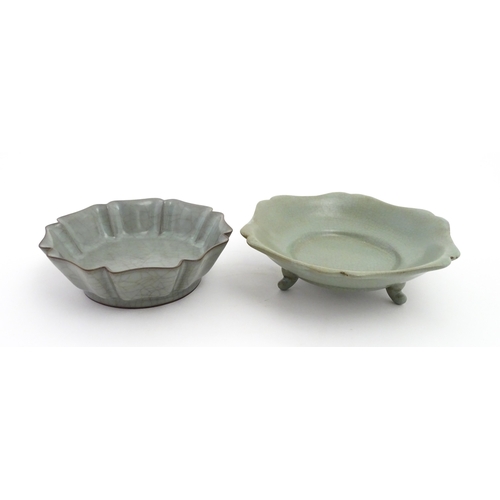 59 - Two Chinese celadon bowls / dishes of stylised lotus leaf form with crackle glazes, one raised on th... 