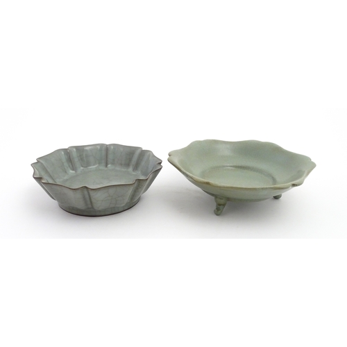 59 - Two Chinese celadon bowls / dishes of stylised lotus leaf form with crackle glazes, one raised on th... 
