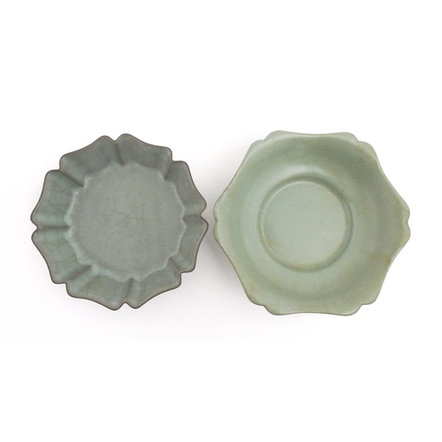 59 - Two Chinese celadon bowls / dishes of stylised lotus leaf form with crackle glazes, one raised on th... 