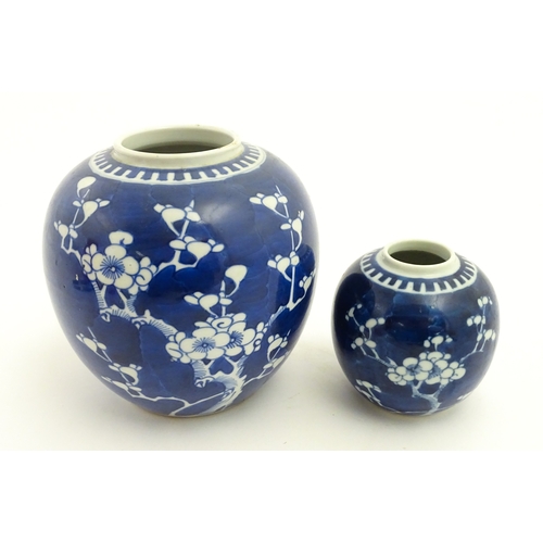 67 - Two Chinese blue and white ginger jars with prunus blossom detail. Largest approx. 6 1/2