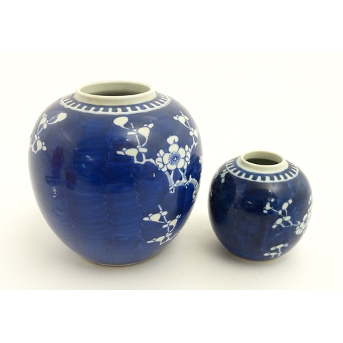 67 - Two Chinese blue and white ginger jars with prunus blossom detail. Largest approx. 6 1/2