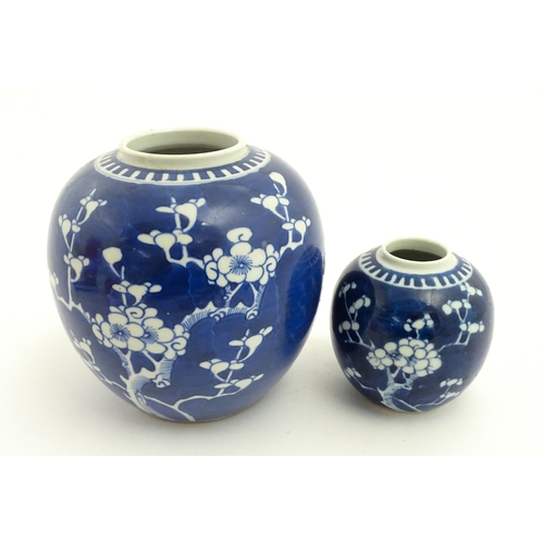 67 - Two Chinese blue and white ginger jars with prunus blossom detail. Largest approx. 6 1/2