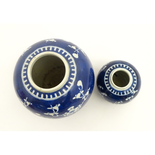 67 - Two Chinese blue and white ginger jars with prunus blossom detail. Largest approx. 6 1/2