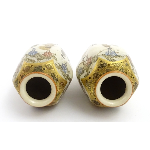 68 - A pair of Japanese Satsuma vases decorated with ladies and blooming wisteria. Character marks under.... 