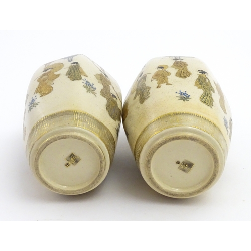 68 - A pair of Japanese Satsuma vases decorated with ladies and blooming wisteria. Character marks under.... 