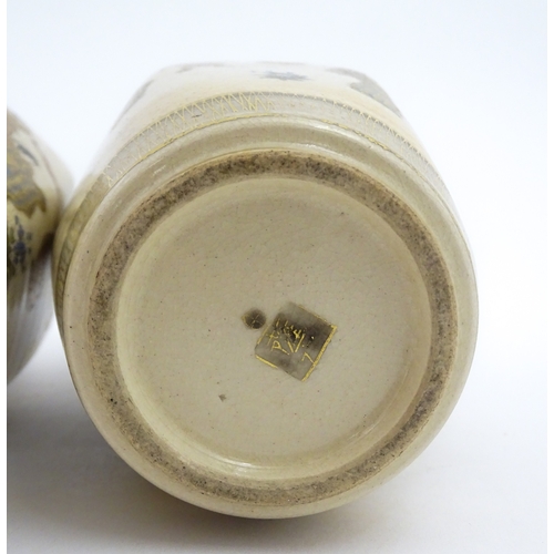 68 - A pair of Japanese Satsuma vases decorated with ladies and blooming wisteria. Character marks under.... 