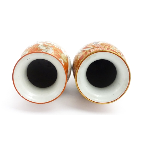 71 - Two Japanese Kutani vases each decorated with birds and flowers. Both bearing Character marks under.... 