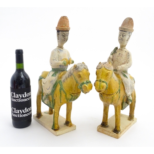 73 - A pair of Chinese Sancai glazed pottery models of a horse and rider / riders on horseback. Approx. 1... 