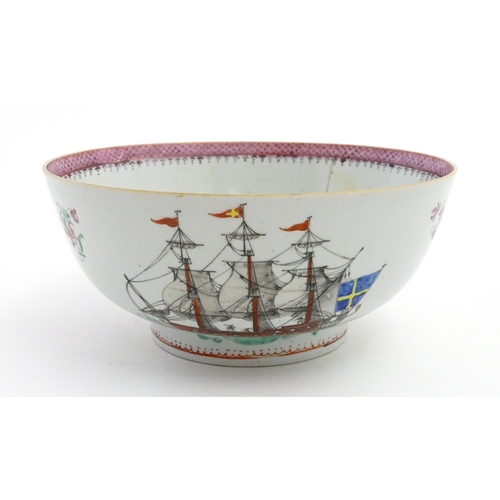 61 - A Chinese export famille rose 'ship' punch bowl decorated with hand painted ships flying the Swedish... 