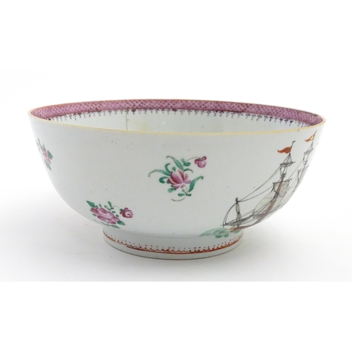 61 - A Chinese export famille rose 'ship' punch bowl decorated with hand painted ships flying the Swedish... 