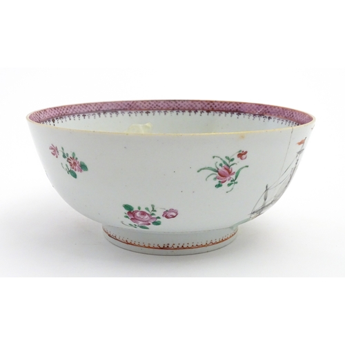 61 - A Chinese export famille rose 'ship' punch bowl decorated with hand painted ships flying the Swedish... 