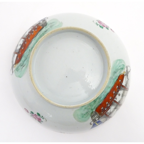 61 - A Chinese export famille rose 'ship' punch bowl decorated with hand painted ships flying the Swedish... 