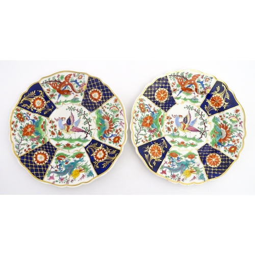 90 - A pair of English plates decorated in the Imari palette depicting a bird to centre bordered by flowe... 