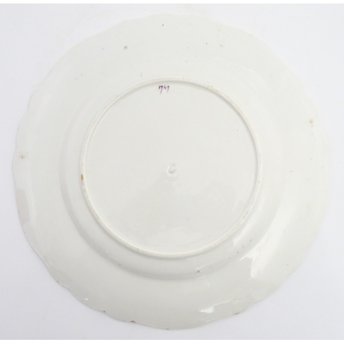 90 - A pair of English plates decorated in the Imari palette depicting a bird to centre bordered by flowe... 
