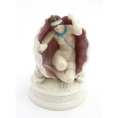 91 - An English figure modelled as the Birth of Venus / Venus emerging from a sea shell, with pink and bl... 