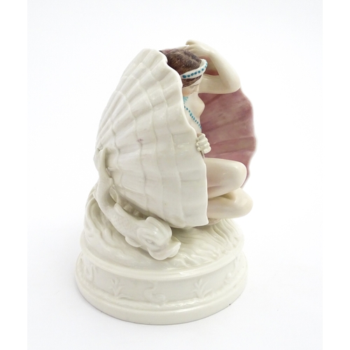 91 - An English figure modelled as the Birth of Venus / Venus emerging from a sea shell, with pink and bl... 