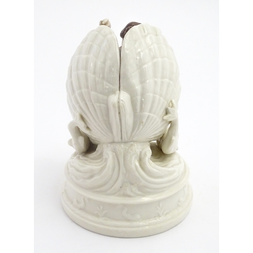 91 - An English figure modelled as the Birth of Venus / Venus emerging from a sea shell, with pink and bl... 
