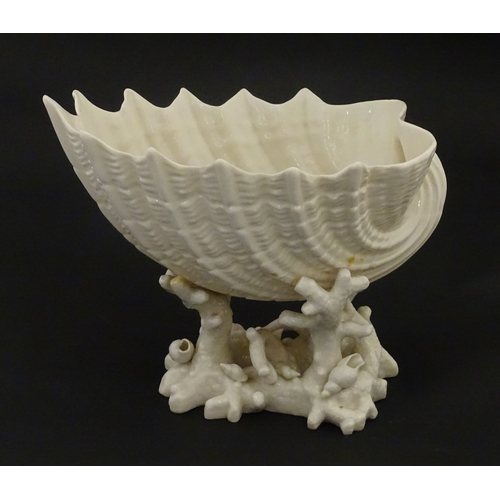 92 - A Belleek Imperial Shell vase with stylised coral base. Bears Second Period mark under. Approx. 8