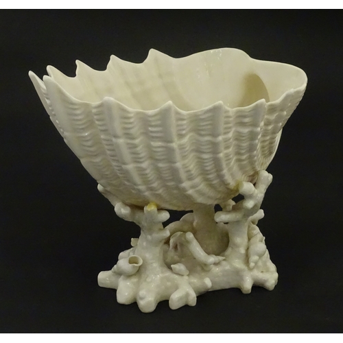 92 - A Belleek Imperial Shell vase with stylised coral base. Bears Second Period mark under. Approx. 8
