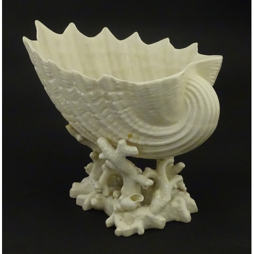 92 - A Belleek Imperial Shell vase with stylised coral base. Bears Second Period mark under. Approx. 8
