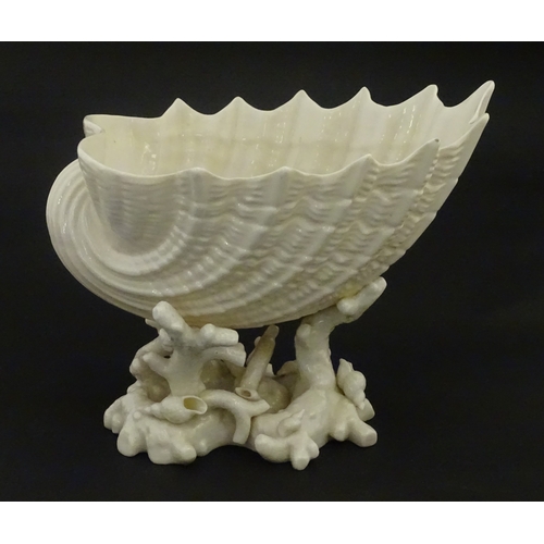 92 - A Belleek Imperial Shell vase with stylised coral base. Bears Second Period mark under. Approx. 8