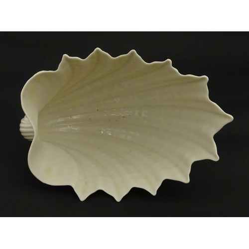 92 - A Belleek Imperial Shell vase with stylised coral base. Bears Second Period mark under. Approx. 8