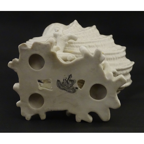 92 - A Belleek Imperial Shell vase with stylised coral base. Bears Second Period mark under. Approx. 8