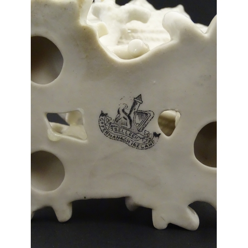 92 - A Belleek Imperial Shell vase with stylised coral base. Bears Second Period mark under. Approx. 8