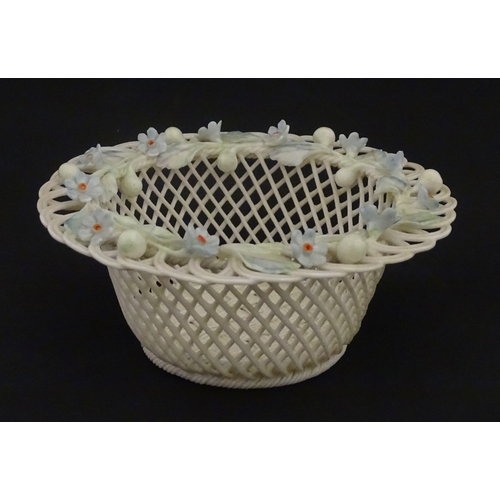 93 - A Belleek four strand basket with painted Forget-Me-Not flowers and leaves to rim. Bears First Perio... 