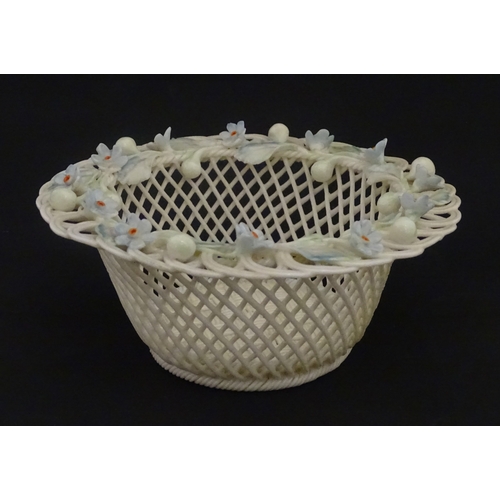 93 - A Belleek four strand basket with painted Forget-Me-Not flowers and leaves to rim. Bears First Perio... 