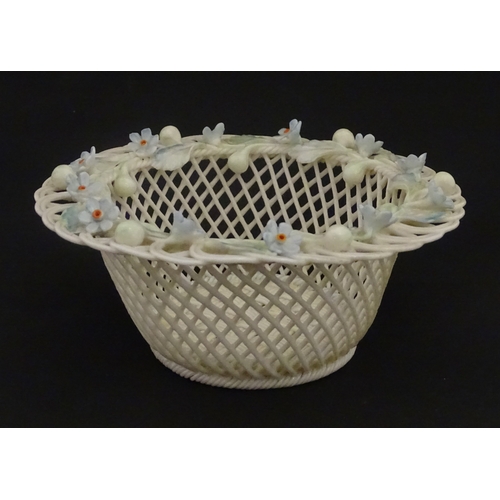 93 - A Belleek four strand basket with painted Forget-Me-Not flowers and leaves to rim. Bears First Perio... 