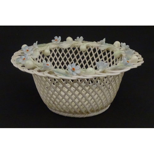 93 - A Belleek four strand basket with painted Forget-Me-Not flowers and leaves to rim. Bears First Perio... 