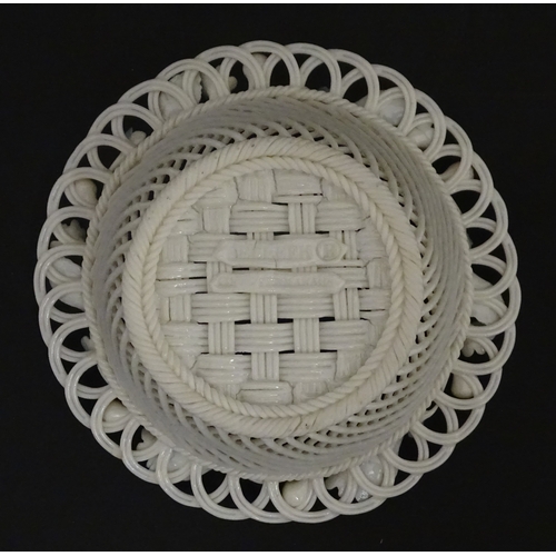 93 - A Belleek four strand basket with painted Forget-Me-Not flowers and leaves to rim. Bears First Perio... 