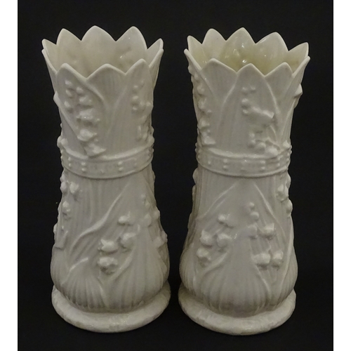95 - A pair of Belleek Lily of the Valley spill vases. Both bearing Second Period marks under. Approx. 6 ... 