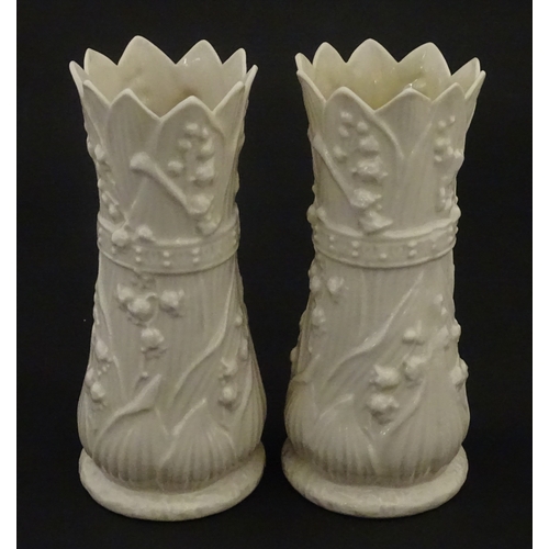 95 - A pair of Belleek Lily of the Valley spill vases. Both bearing Second Period marks under. Approx. 6 ... 
