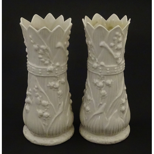95 - A pair of Belleek Lily of the Valley spill vases. Both bearing Second Period marks under. Approx. 6 ... 