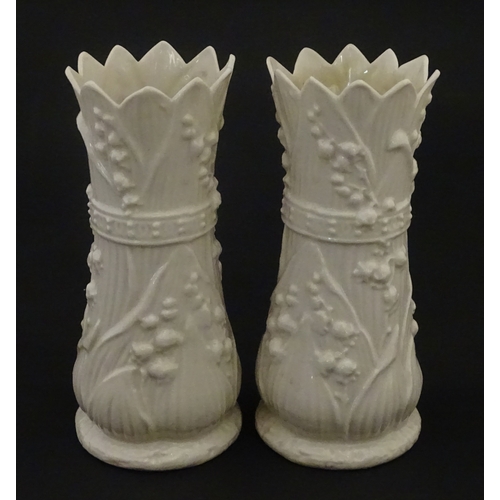 95 - A pair of Belleek Lily of the Valley spill vases. Both bearing Second Period marks under. Approx. 6 ... 
