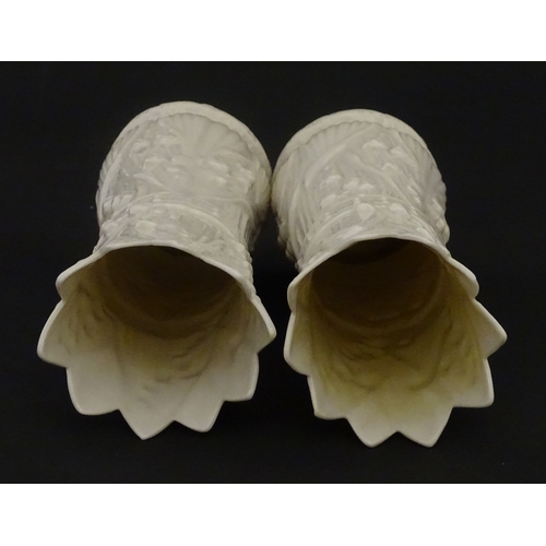 95 - A pair of Belleek Lily of the Valley spill vases. Both bearing Second Period marks under. Approx. 6 ... 