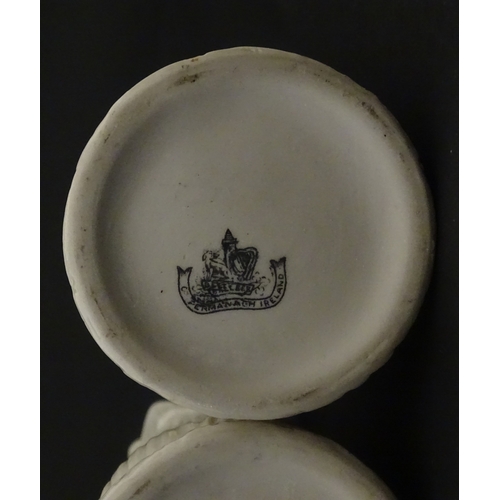 95 - A pair of Belleek Lily of the Valley spill vases. Both bearing Second Period marks under. Approx. 6 ... 