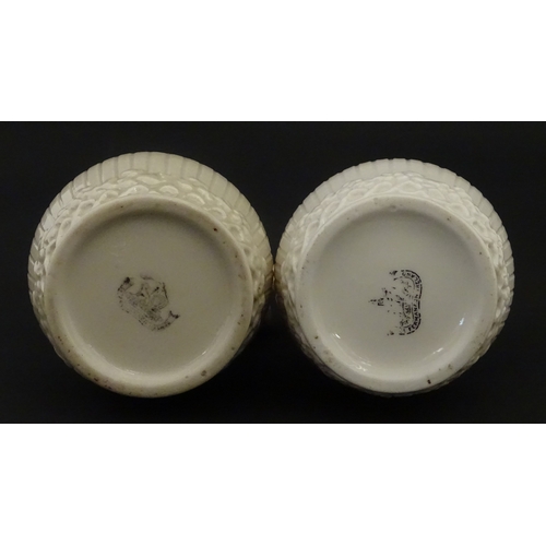 96 - A pair of Belleek Harp jugs / pitchers with banded decoration. Both bearing Second Period marks unde... 