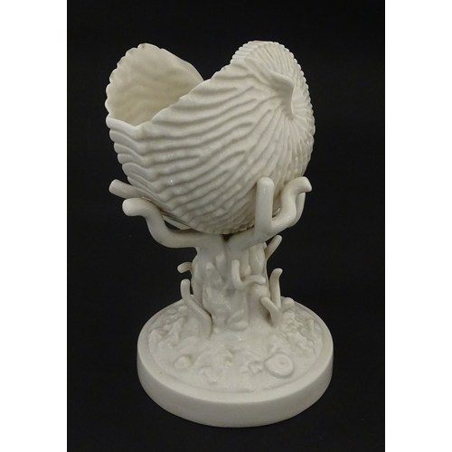 98 - A Belleek Nautilus Shell comport / centrepiece vase with stylised coral base. Bearing First Period m... 