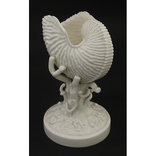 98 - A Belleek Nautilus Shell comport / centrepiece vase with stylised coral base. Bearing First Period m... 