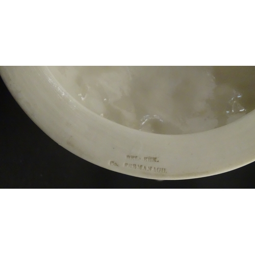 98 - A Belleek Nautilus Shell comport / centrepiece vase with stylised coral base. Bearing First Period m... 