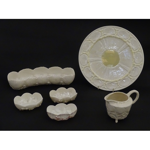 99 - Six Belleek wares in the New Shell Yellow pattern to include plate, milk jug, tray and dishes. To in... 
