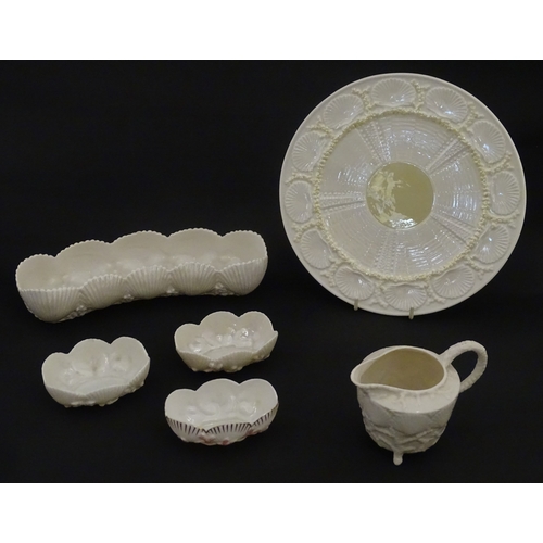 99 - Six Belleek wares in the New Shell Yellow pattern to include plate, milk jug, tray and dishes. To in... 