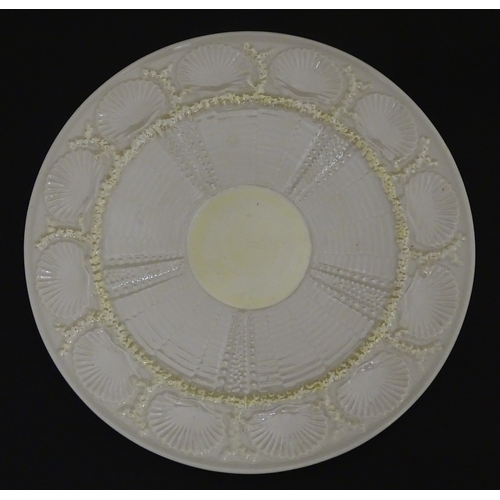 99 - Six Belleek wares in the New Shell Yellow pattern to include plate, milk jug, tray and dishes. To in... 