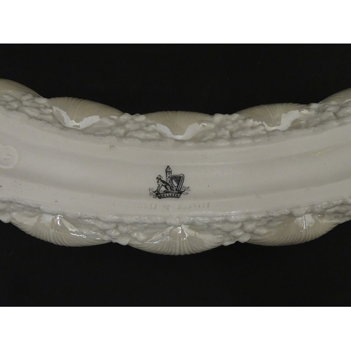 99 - Six Belleek wares in the New Shell Yellow pattern to include plate, milk jug, tray and dishes. To in... 