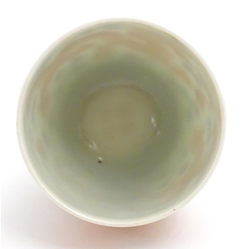 65A - A small Chinese cup decorated with dragons and flaming pearl of wisdom detail. Character marks under... 